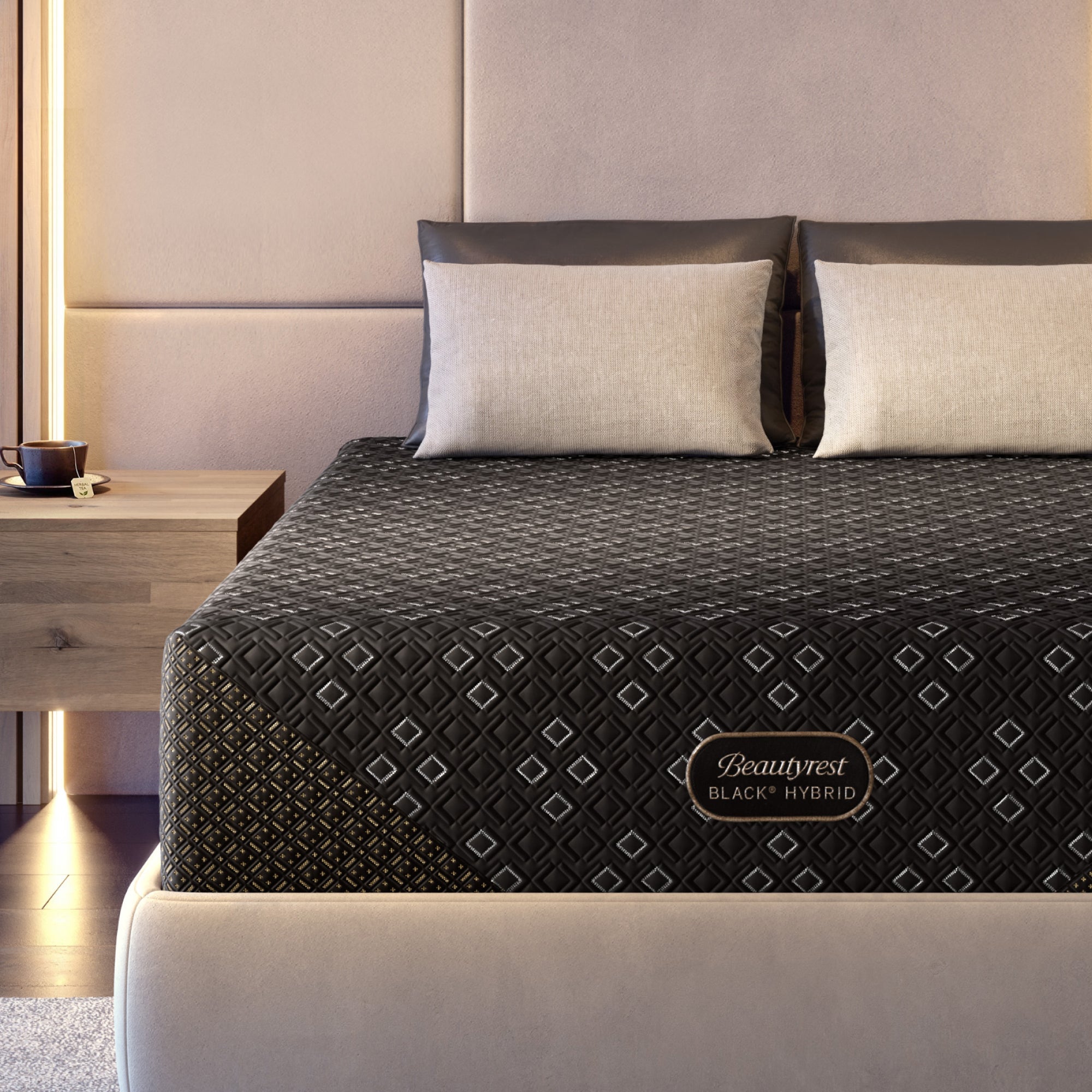Beautyrest Black Hybid XCS plush mattress on a beige bed frame with beige pillows in a modern bedroom setting.